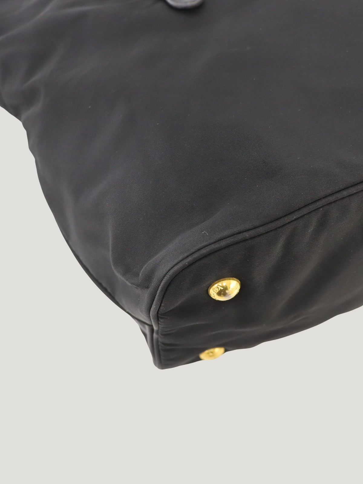 Triangular logo hardware nylon and leather tote bag