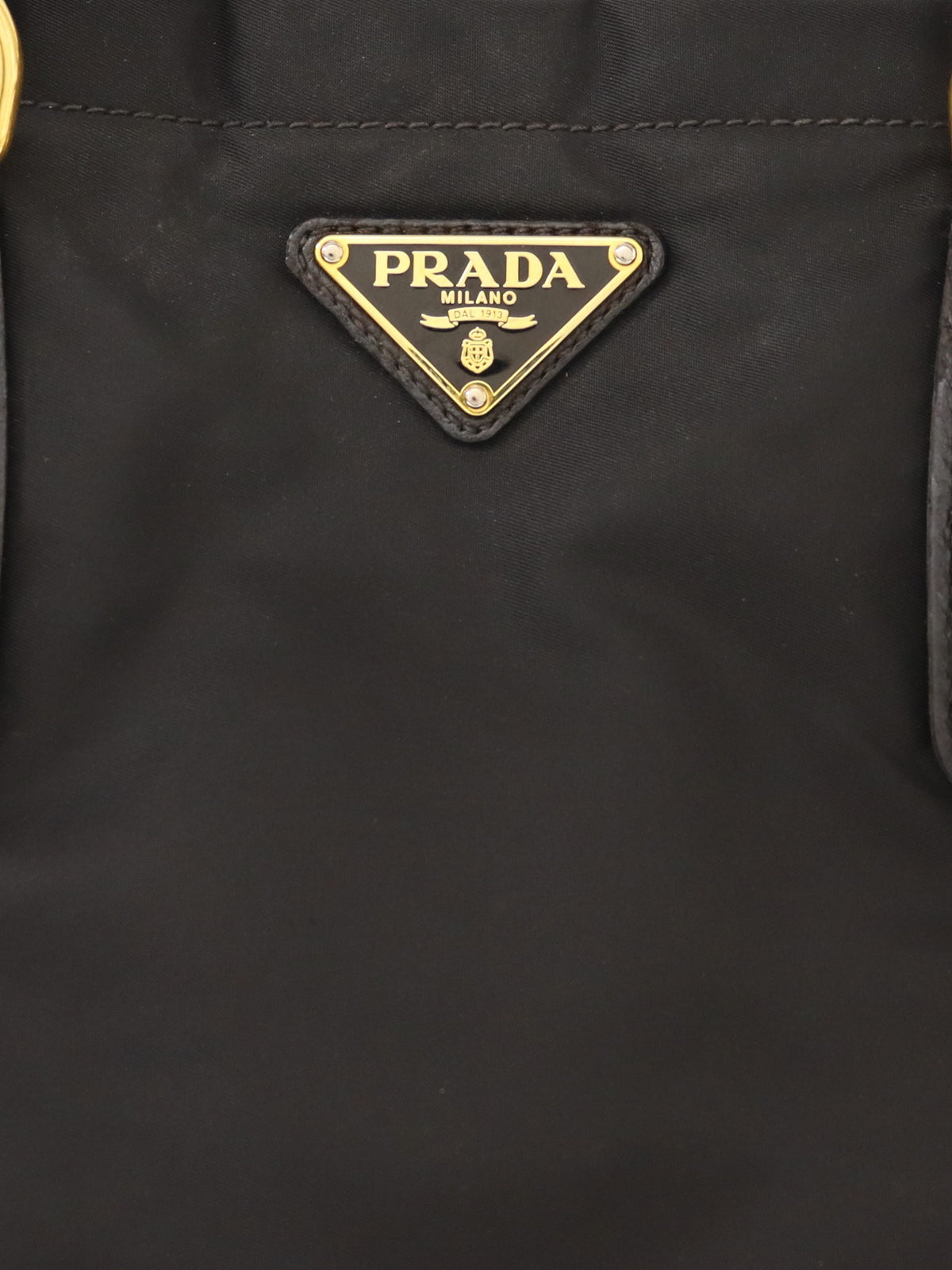 Triangular logo hardware nylon and leather tote bag