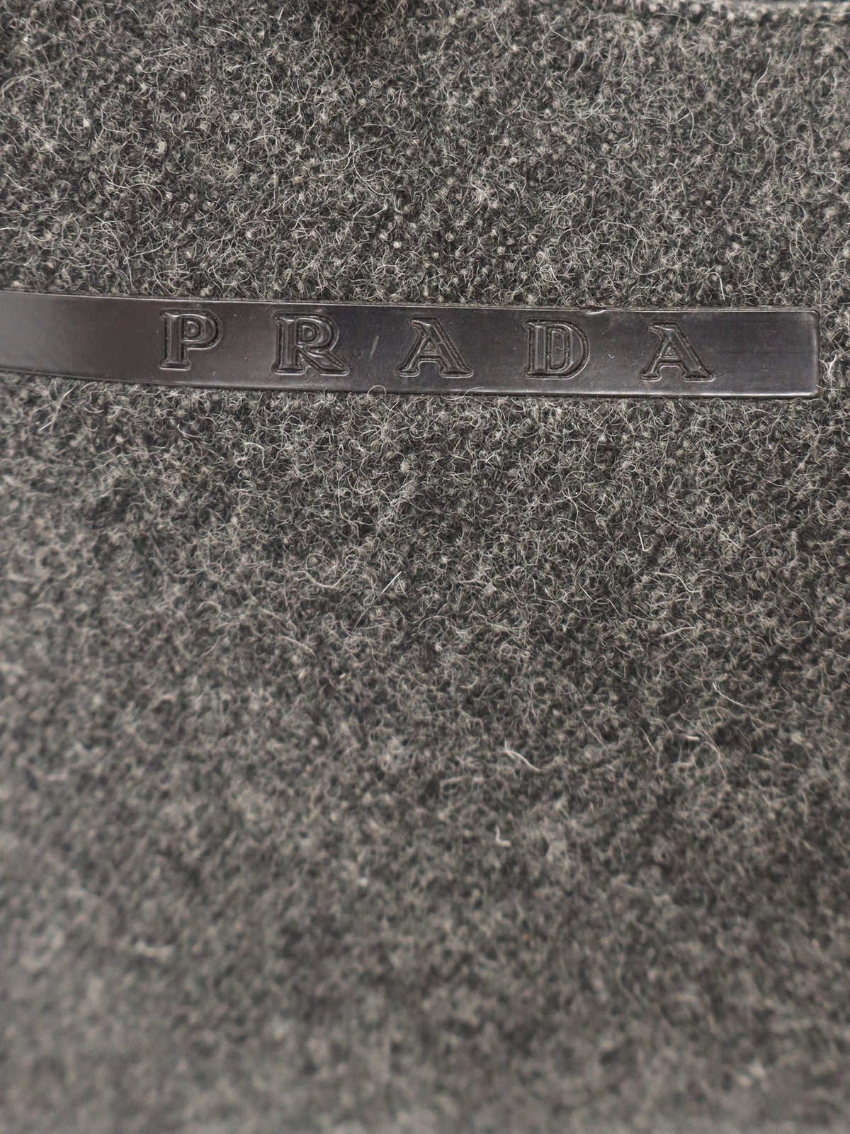 Logo-engraved wool handbag